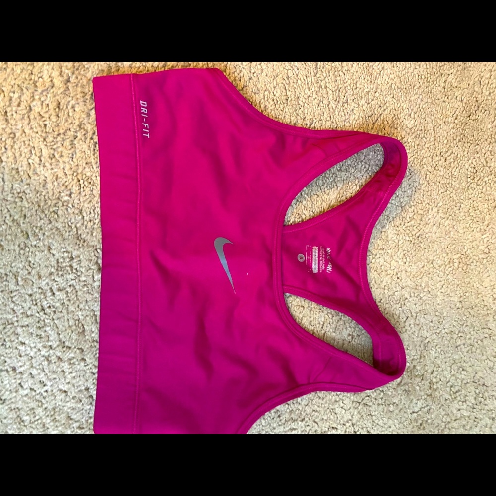 Dark pink Nike sports bra